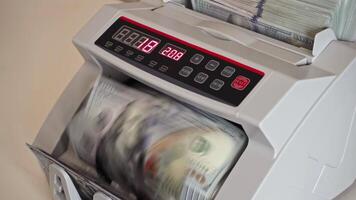Currency counting machine in use with bills being processed video