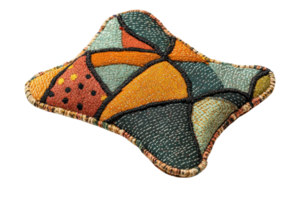 Colorful decorative pillow with abstract geometric pattern, featuring vibrant shapes in various colors. Perfect for home decor and comfort. png