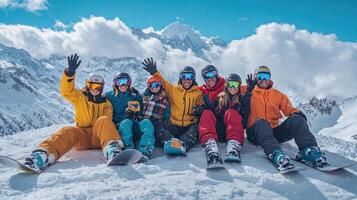 Group of snowboarders posing on a snowy mountain peak photo