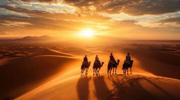 Camel Caravan Silhouette at Sunset in the Sahara Desert photo