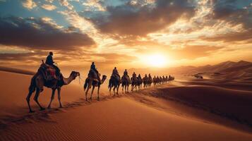 Camel Caravan Crossing the Sahara Desert at Sunset photo