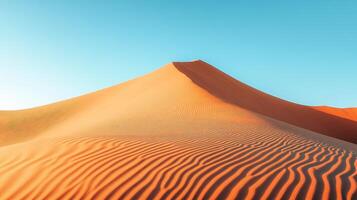 A Serene View of Sand Dunes Against a Blue Sky photo