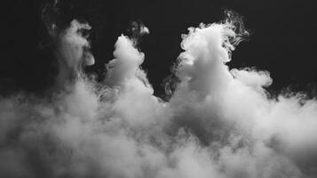White Smoke Plumes Against a Dark Background photo