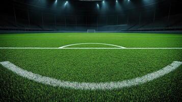 Green Football Field with White Lines and Goalposts Under Stadium Lights photo
