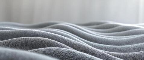 Soft gray carpet texture suitable for interior design featuring gentle waves and an elegant backdrop for various decoration projects. photo