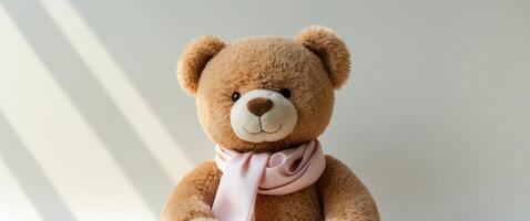 a teddy bear with a scarf around its neck. photo