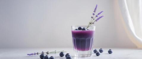 Elegant Blueberry Juice Garnished with Lavender and Whole Berries photo