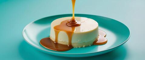 Creamy Flan Dessert with Glossy Caramel Sauce on Vibrant Turquoise Background. photo