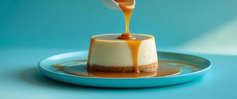 Creamy Flan Dessert with Glossy Caramel Sauce on Vibrant Turquoise Background photo