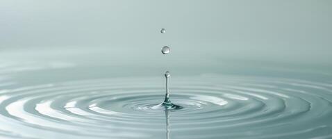 Water Droplet Splashing and Creating Ripples in a Still Body of Water. photo