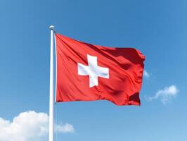 Swiss flag waving against a clear blue sky on a sunny day, representing national pride and heritage in Switzerland photo