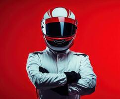 Race car driver in helmet poses confidently against a vibrant red background photo