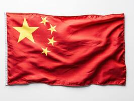 Chinese flag displayed prominently showcasing vibrant colors and symbolic stars against a plain backdrop photo