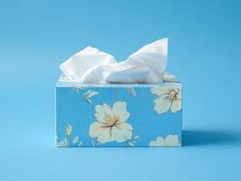 Floral tissue box on a blue background showcasing a fresh and clean design for everyday use photo