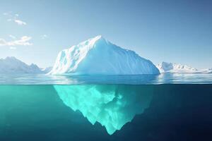 Iceberg floating in calm waters with a stunning view of its submerged portion and clear blue sky above photo