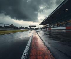 Rain-soaked racetrack shines under dark clouds before a thrilling motorsport event at twilight photo