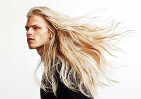 Long flowing hair showcases vibrant style in a dramatic portrait of a young man against a bright background photo