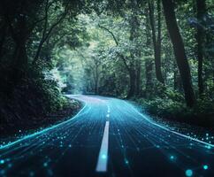 Winding road through lush forest illuminated by glowing blue lines and digital elements photo