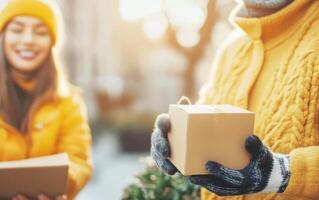 Worker delivering box with warm smile to client in sunny outdoor setting, showcasing joy and connection during delivery process photo