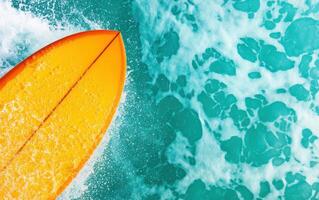 vibrant orange surfboard glides through turquoise waves, creating splashes of foam and excitement photo