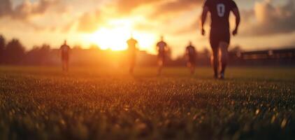 Rugby players warming up on field at sunset, creating vibrant atmosphere photo