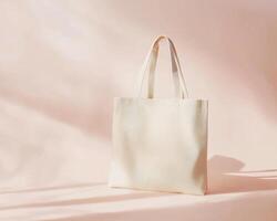 simple flat lay composition of stylish tote bag against soft pastel background, showcasing its elegant design and texture. Perfect for everyday use or shopping photo