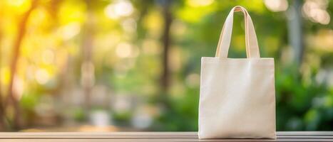 Stylish tote bag on wooden table in sunny outdoor setting, perfect for summer outings. natural light enhances its casual appeal and versatility photo