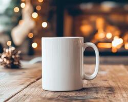 blank white mug on wooden table with cozy fireplace in background, creating warm and inviting atmosphere perfect for winter holidays photo