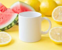 blank white mug surrounded by fresh watermelon and lemons on vibrant yellow background creates cheerful and refreshing scene photo