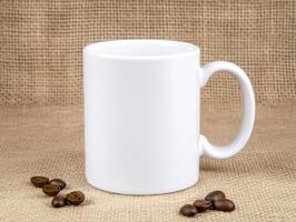 close up of blank white mug surrounded by coffee beans, perfect for showcasing designs or branding. rustic background adds warmth to scene photo