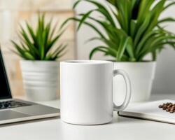 blank white mug sits on desk next to laptop and potted plants, creating serene workspace atmosphere. Perfect for showcasing designs or branding photo