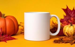 blank white mug surrounded by colorful autumn leaves and pumpkins, creating warm and inviting seasonal atmosphere. Perfect for showcasing custom designs or branding photo
