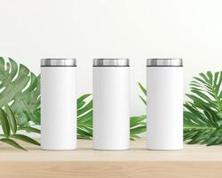 Minimalist design featuring three blank white tumblers surrounded by green leaves, perfect for showcasing branding or personal designs. Ideal for promotional use or product photography photo