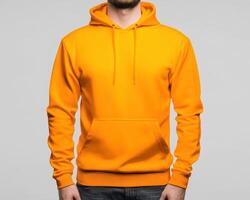 Bright orange hoodie with front pocket and drawstring hood, perfect for casual wear. Ideal for layering or standalone style photo