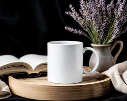 blank white mug sits on wooden tray beside open book and vase of lavender flowers, creating serene and inviting atmosphere perfect for relaxation photo