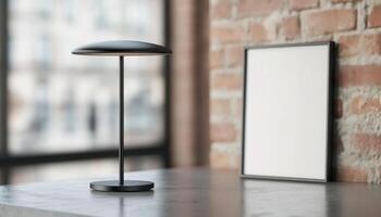 Modern black lamp on concrete table beside blank frame against brick wall, creating stylish and minimalistic interior design photo