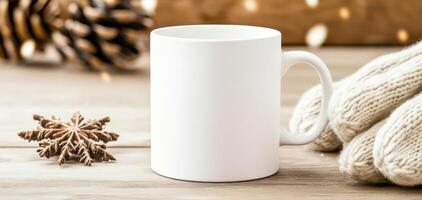 blank white mug is placed on wooden surface, surrounded by festive decorations like pine cones and snowflake ornament, evoking cozy winter atmosphere photo