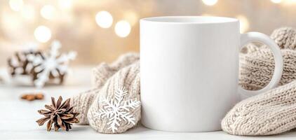 blank white mug surrounded by cozy knit fabric, pine cones, and snowflake decorations, creating warm winter atmosphere. Perfect for holiday themed designs photo