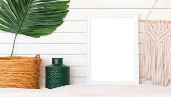 blank white frame mockup in bohemian bedroom setting with green vase, woven basket, and decorative wall hanging. scene exudes calm and inviting atmosphere photo