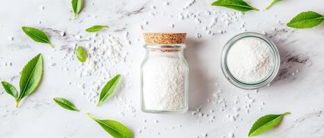 Stevia leaves and powdered sweetener arranged on marble surface, creating fresh and natural aesthetic. green leaves contrast beautifully with white powder, evoking sense of health and wellness photo