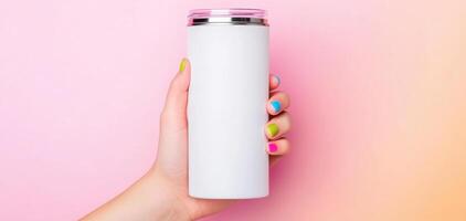 cheerful hand holding sleek, white tumbler against pastel pink background. colorful nails add playful touch to scene, creating vibrant and inviting atmosphere photo