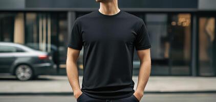 solid black t shirt worn by man, showcasing modern and stylish look in city setting. crisp lighting highlights fabric and fit, creating sleek appearance photo