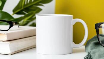 blank white mug placed on table with books and glasses, surrounded by greenery, creating calm and inviting atmosphere photo