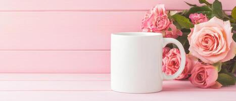 white mug placed on pastel pink table next to pink roses, creating serene and elegant atmosphere. Perfect for showcasing beverages or gifts photo