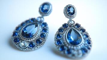 Set of elegant earrings made of vivid aquamarines moonstones shimmering under light closeup field capturing the gem textures on a pure white background photo