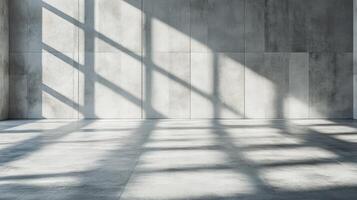 Bright sunlight casts intricate shadows across a spacious concrete area, creating artful patterns photo