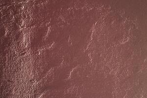 Red textured varnish with light effects and shadows. photo
