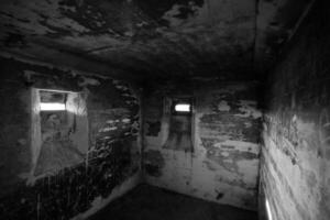 View in a small confined room in an old WWII bunker near Lostau, Saxony-Anhalt, Germany. Black and white image. photo