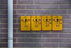 Gate valve sign for natural gas pipes in Germany. The abbreviation on the top left specifies the type of gate valve. The other numbers give size and position of the pipe photo
