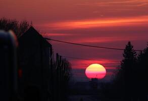 Sunset with strong red colors in an industrial district. photo